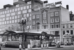 black and white vintage photo of the cambridge kiosk, a rectangular building with a arched ceiling.