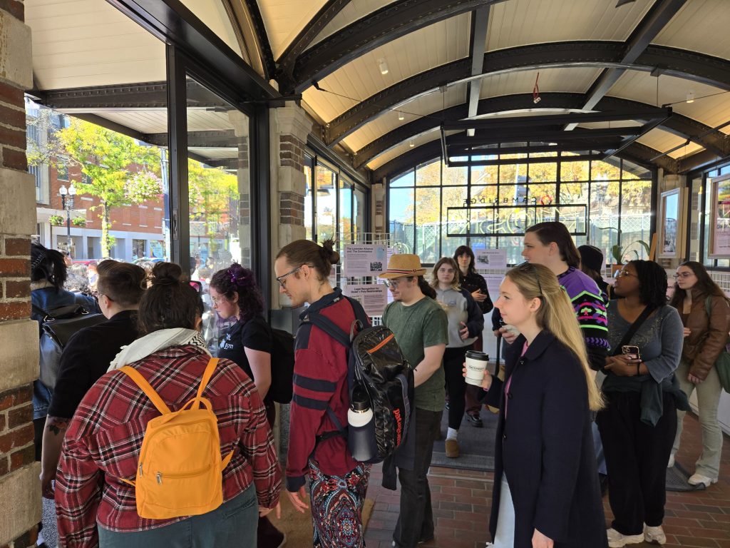 Visitors head out of the KiOSK for a walking tour as part of the Queer History exhibition